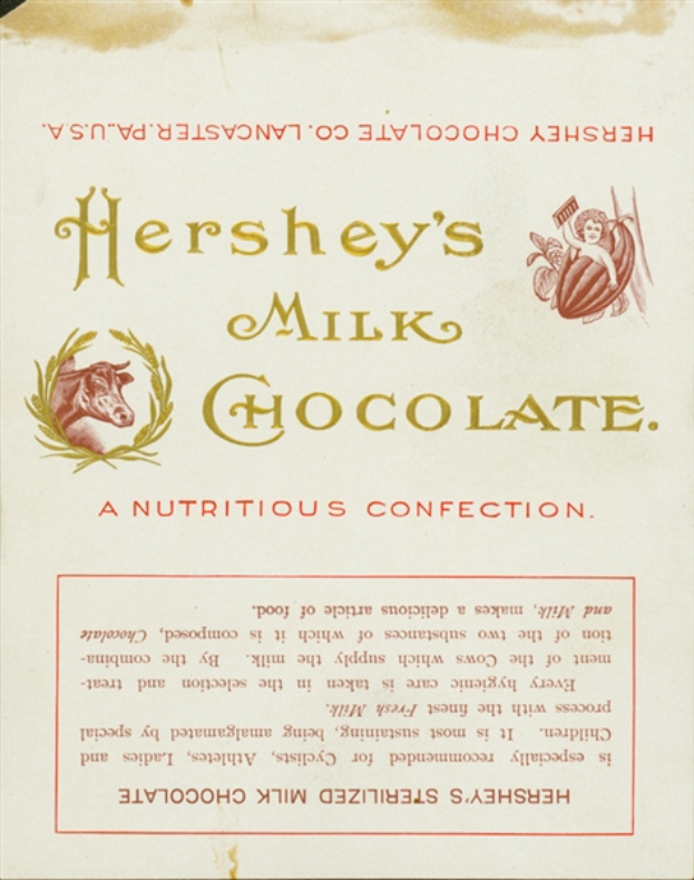 Ein Plakat mit dem Text "Hershey's Milchschokolade - Eine nahrhafte Süßigkeit" und einem realistischen Bild einer Kuh mit nach vorne gerichtetem Kopf und aufgestellten Ohren auf einem hellbraunen Hintergrund.