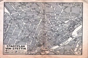 Ein detailliertes altes Stadtplan von Stuttgart auf Papier, der Straßen, Gebäude und Sehenswürdigkeiten zeigt, mit zusätzlichem Text für Informationen.