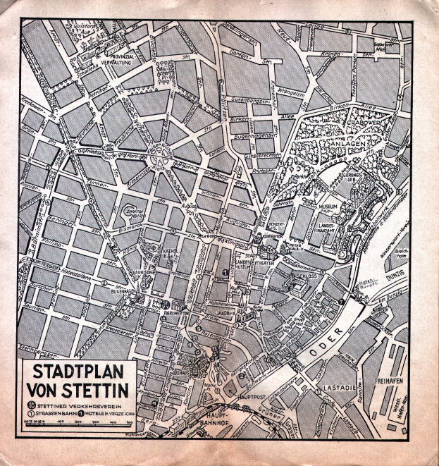 Ein detailliertes altes Stadtplan von Stuttgart auf Papier, der Straßen, Gebäude und Sehenswürdigkeiten zeigt, mit zusätzlichem Text für Informationen.