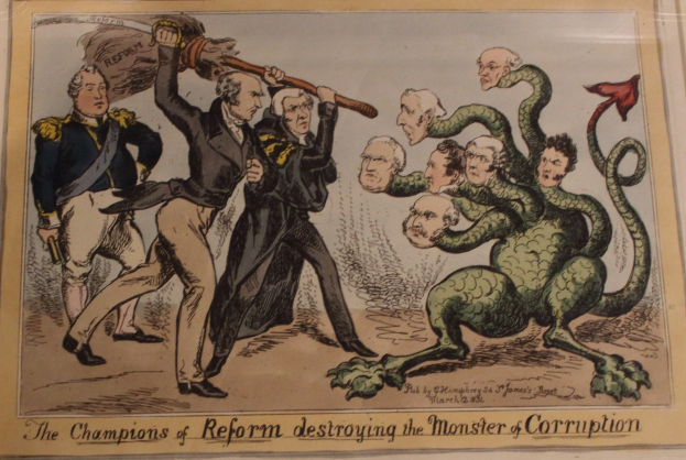 Eine Karikatur auf einem Blatt, das die Champions of Reform zeigt, die ein Monster namens 'Korruption' besiegen, mit dem Text 'Die Champions of Reform zerstören das Monster der Korruption'.