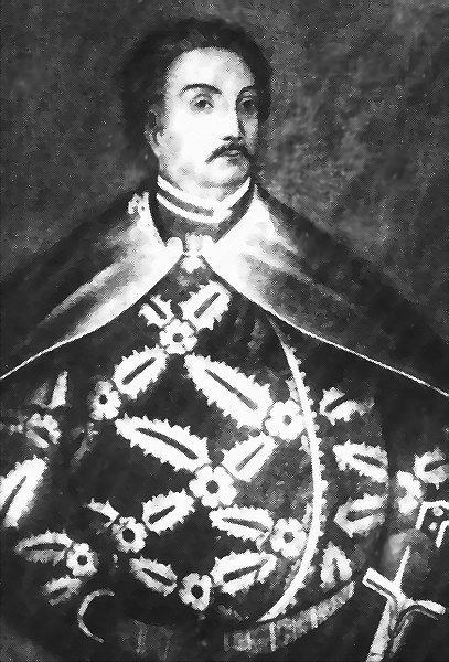 Schwarzes und weißes Foto von Papst Johannes Paul II. in Priesterroben, der eine schwarze Robe mit weißem Kragen und Manschetten trägt und die Hände gefaltet hat, mit ernster Miene und direktem Blick.