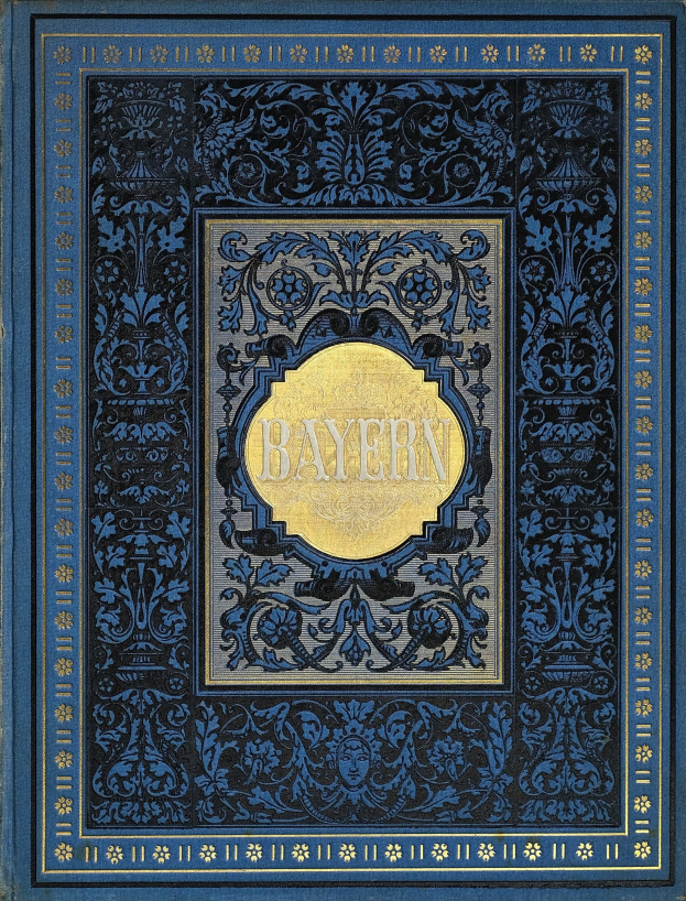 Ein blau-goldenes Buch mit dem Wort 'Bayern' auf dem Cover, das mit kunstvollen Verzierungen geschmückt ist.