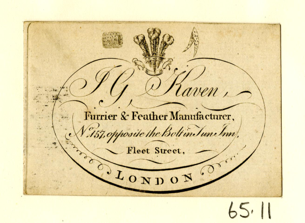 Eine alte Visitenkarte mit einem Schwarz-Weiß-Kronenbild und Text, der wahrscheinlich den Namen des Unternehmens angibt.